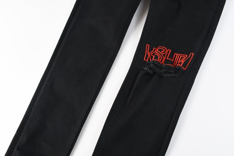 KSUBI denim black distressed skinny jeans red embroidered writing
