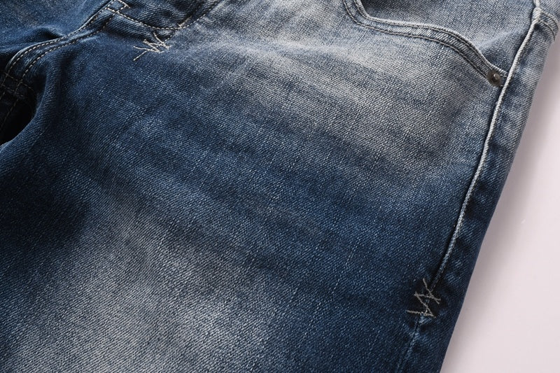 KSUBI denim dark blue lightly  distressed skinny jeans with white writing