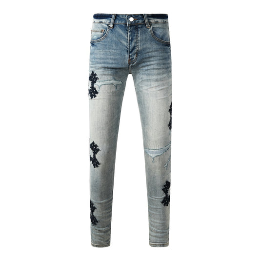 Amiri jeans light blue with black distressed patches