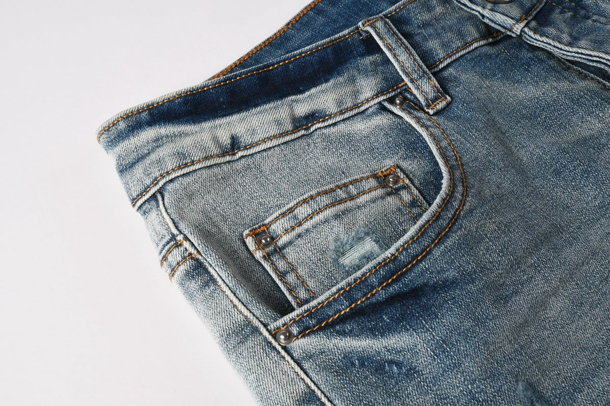 Amiri jeans light blue with black distressed patches