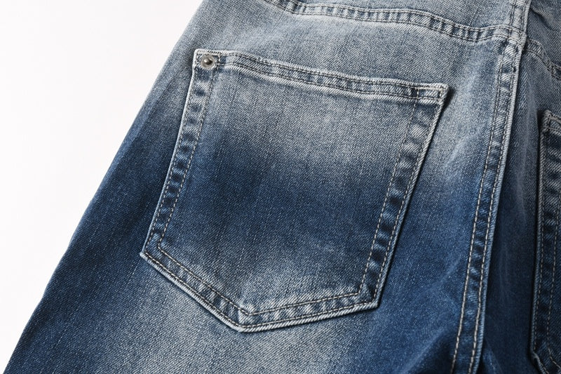 KSUBI denim dark blue lightly  distressed skinny jeans with white writing