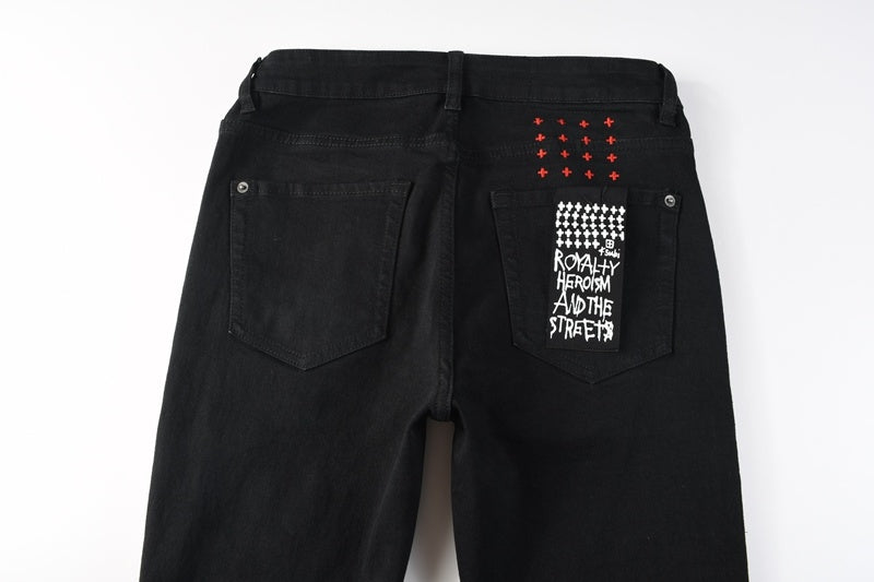 KSUBI denim black distressed skinny jeans red embroidered writing