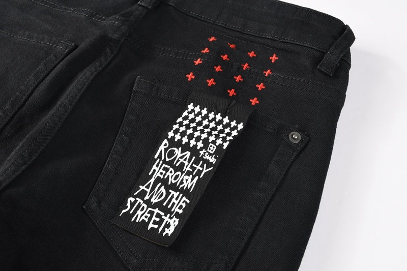 KSUBI denim black distressed skinny jeans red embroidered writing