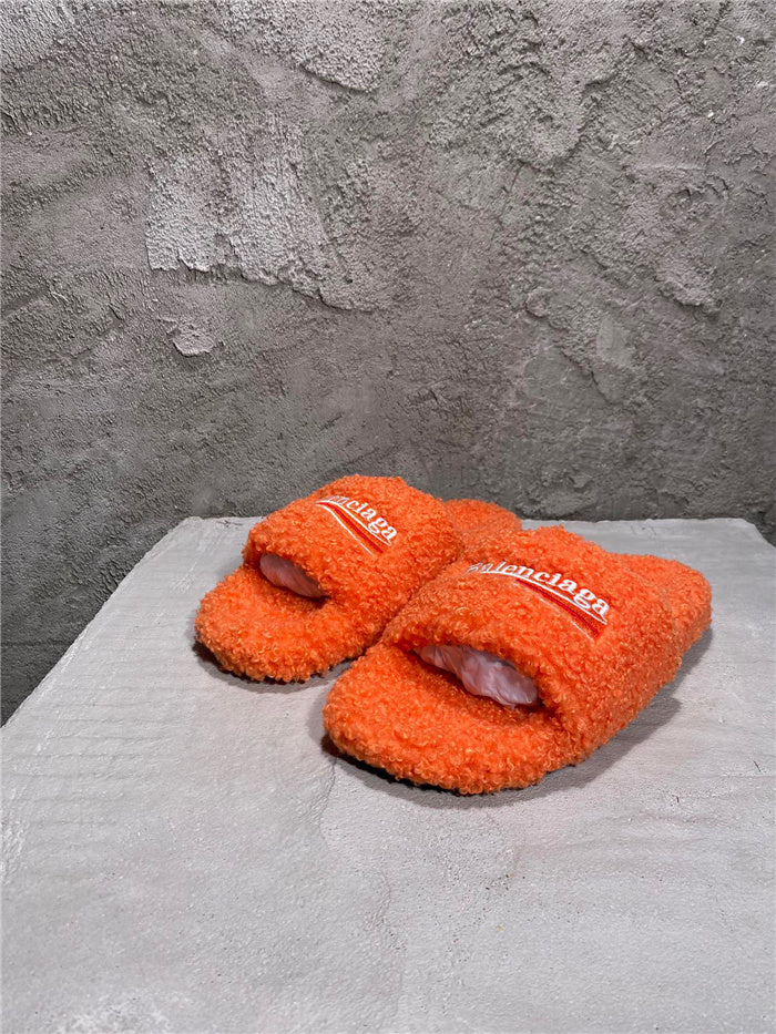 Balenciaga black furry slides orange