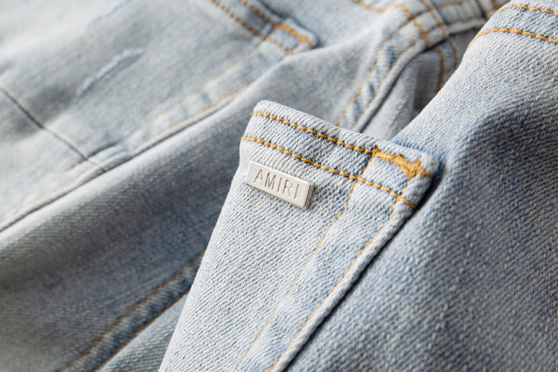 Amiri jeans light gray distressed