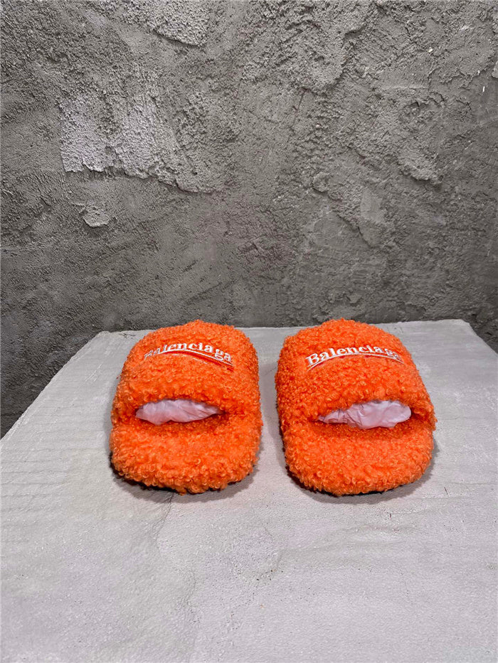 Balenciaga black furry slides orange