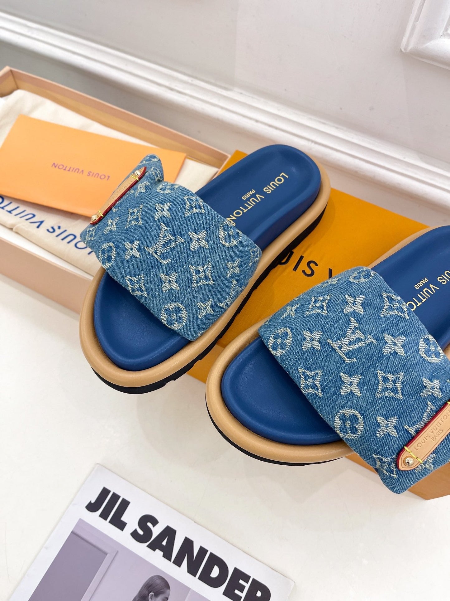 Dark blue Louis Vuitton slides