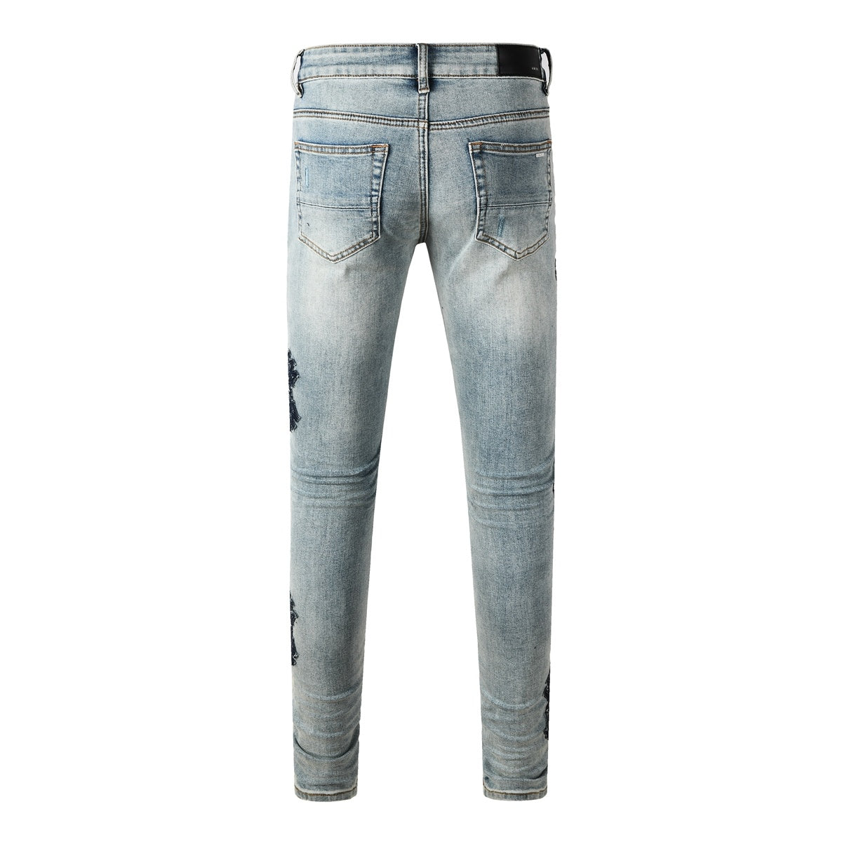 Amiri jeans light blue with black distressed patches