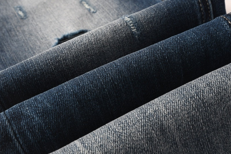 KSUBI denim dark blue lightly  distressed skinny jeans with white writing