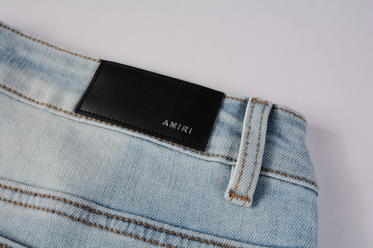 Amiri jeans light blue with paint splatter