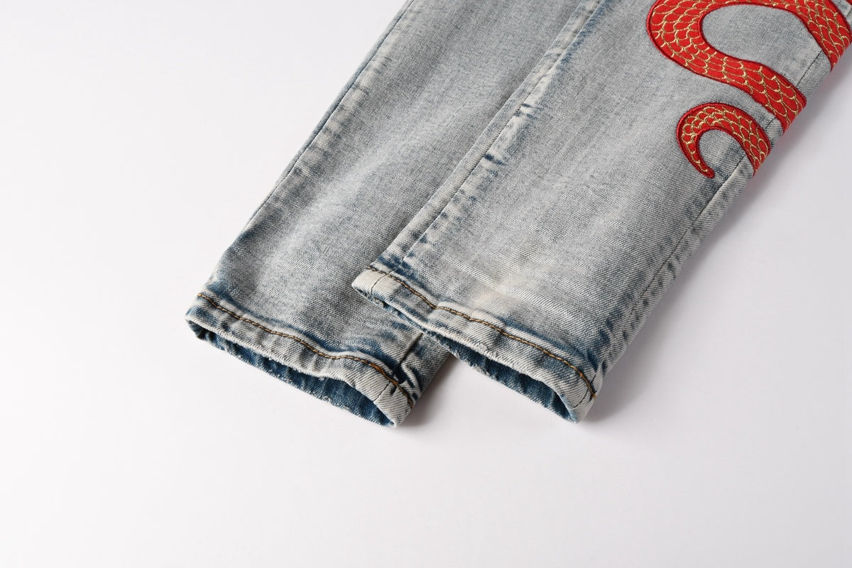 Amiri jeans light blue with  snake