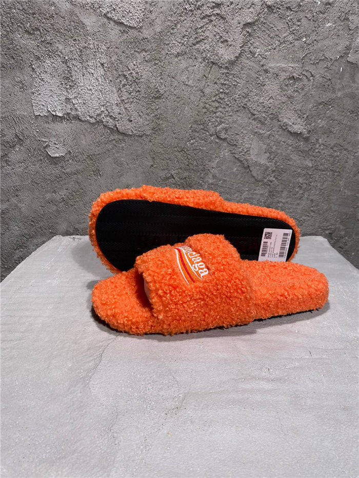 Balenciaga black furry slides orange