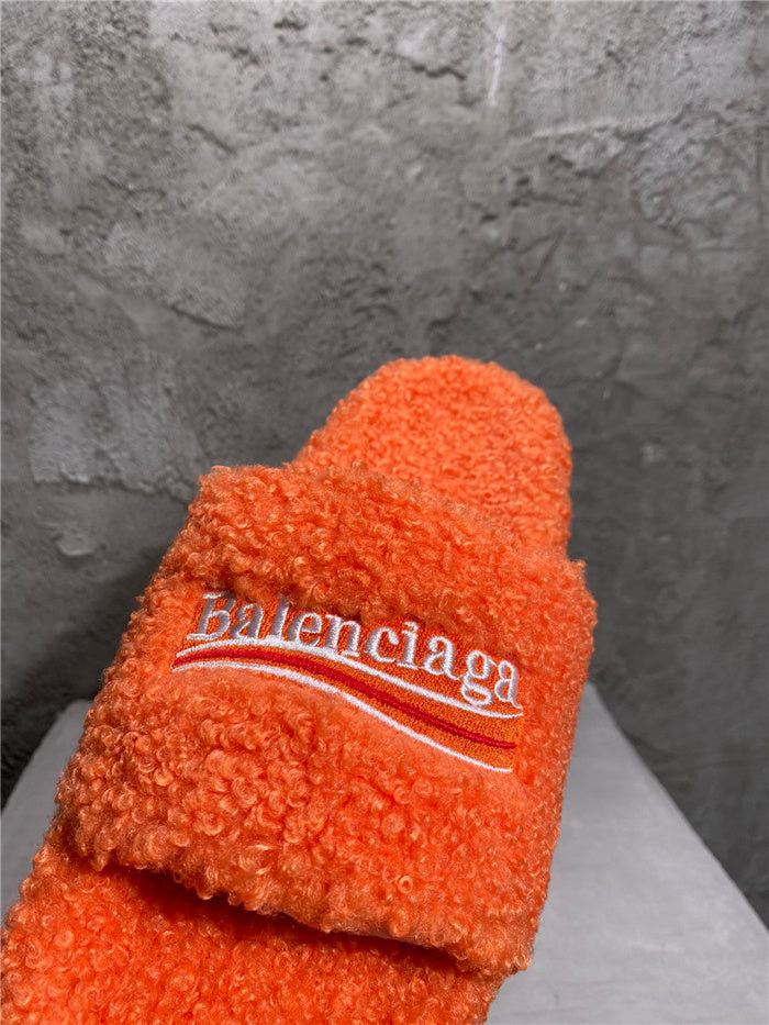 Balenciaga black furry slides orange