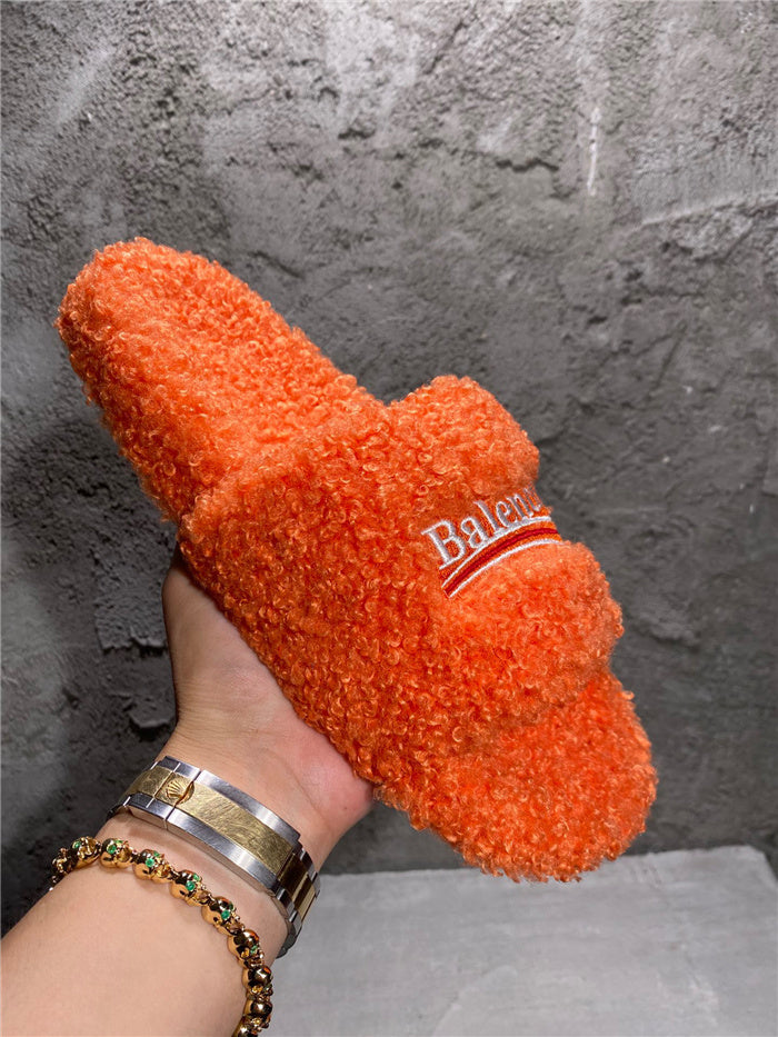Balenciaga black furry slides orange