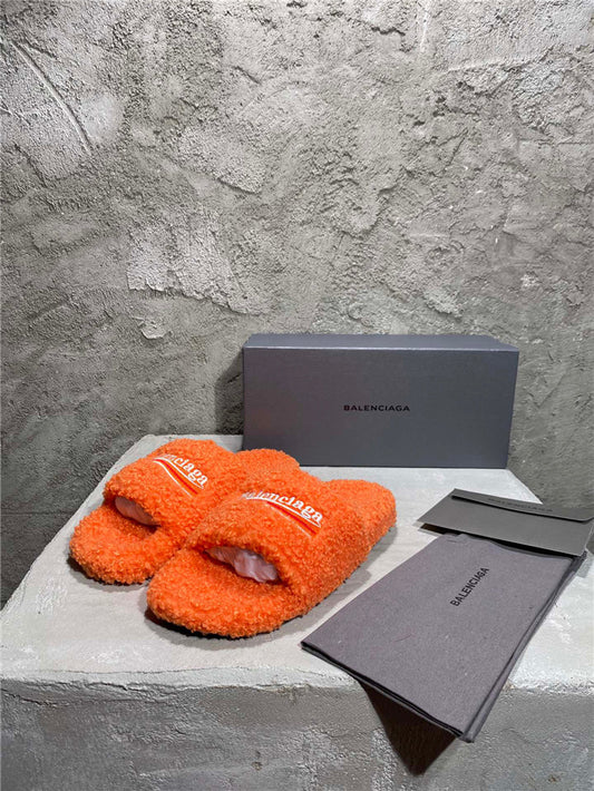 Balenciaga black furry slides orange