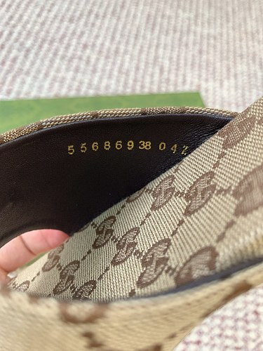 Gucci Women's Slide Sandals in sand and dark brown GG canvas.